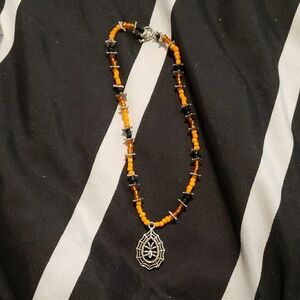 Orange and Black Beaded Necklace with Spider Web Pendant